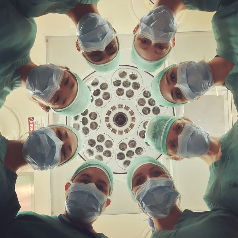 Surgical team looking down in a circle